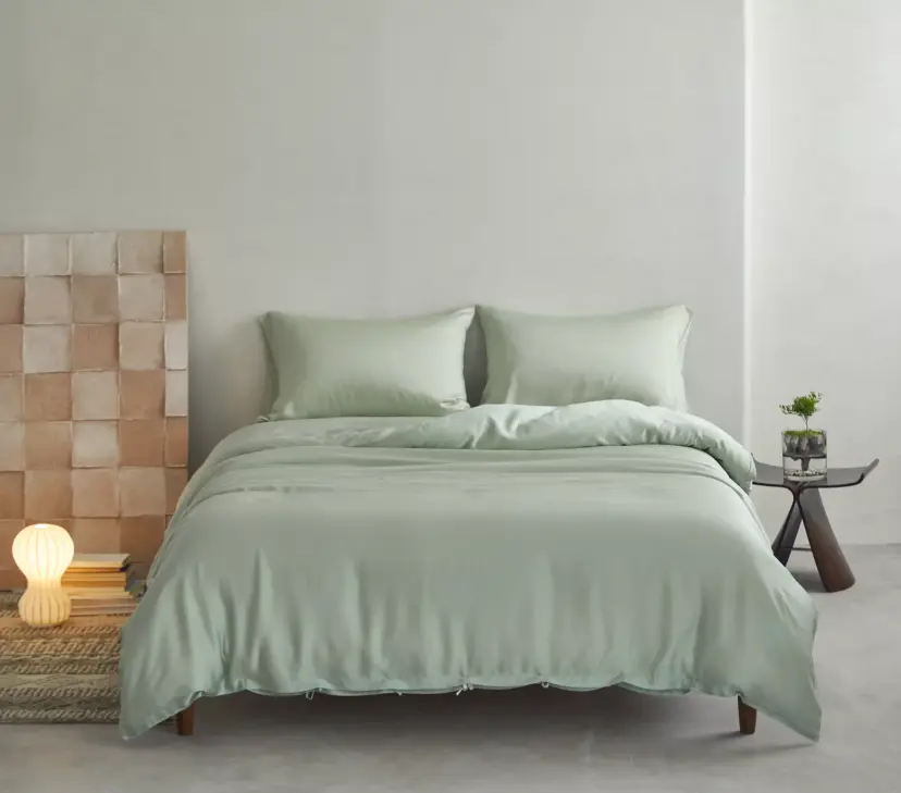 Shangrila sheets in sage on a made bed
